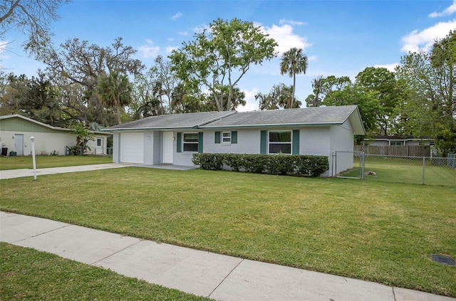 1986 Big Oak Dr, South Daytona, FL 32119 - ranch-style home featuring a front lawn, driveway, fence, a garage, and brick siding