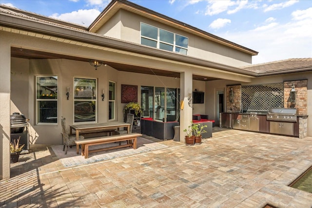 view of patio / terrace featuring an outdoor kitchen and grilling area