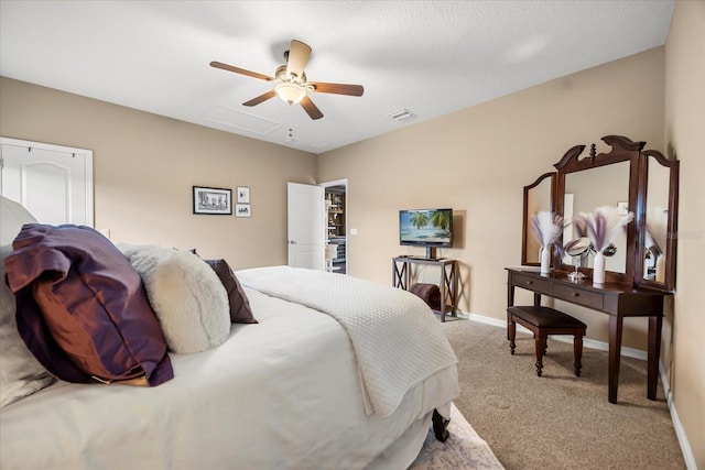 carpeted bedroom featuring visible vents, ceiling fan, and baseboards