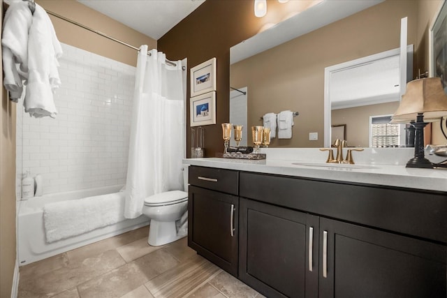 bathroom with vanity, toilet, and shower / tub combo