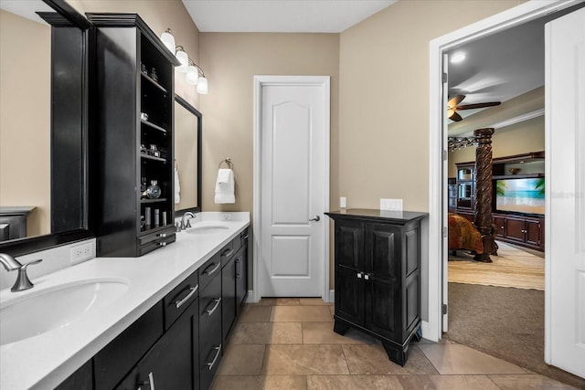 ensuite bathroom featuring a sink, a ceiling fan, double vanity, and ensuite bathroom