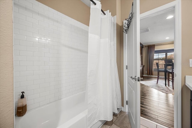 full bath with tile patterned flooring, recessed lighting, and shower / bath combo