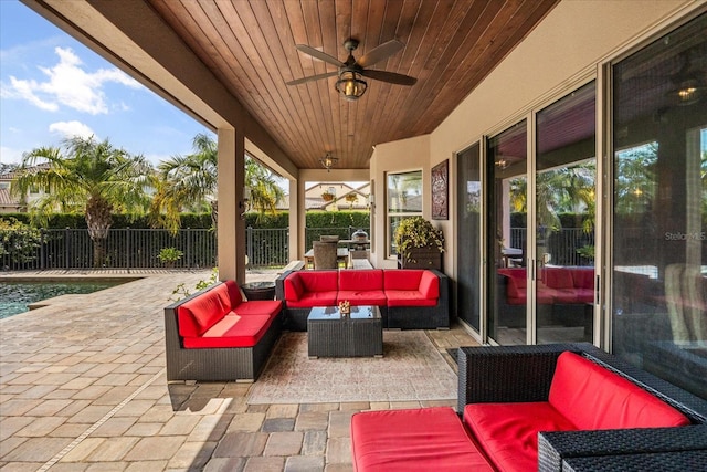 view of patio / terrace featuring an outdoor hangout area, a ceiling fan, and fence