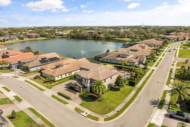 birds eye view of property featuring a residential view and a water view