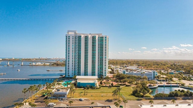 birds eye view of property with a water view and a city view