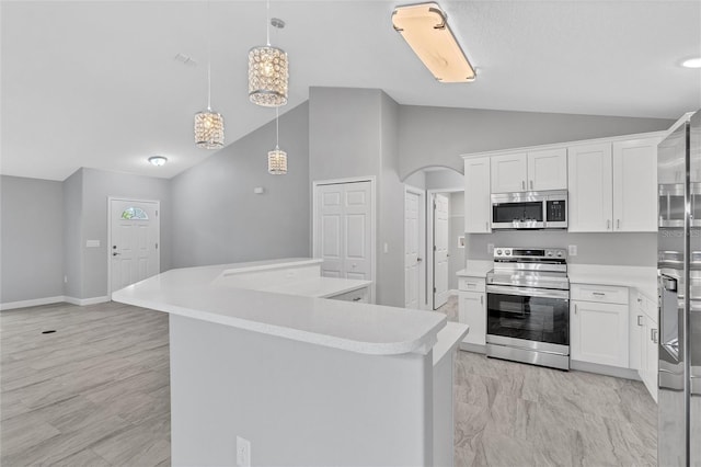 1329 N Old Mill Dr, Deltona, FL 32725 - kitchen featuring a center island, light countertops, vaulted ceiling, arched walkways, and stainless steel appliances