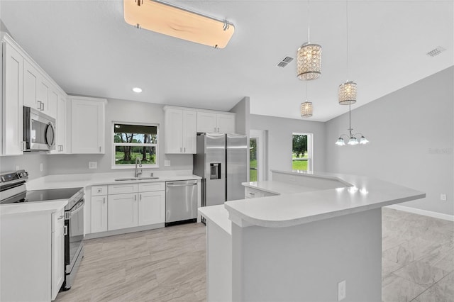 1329 N Old Mill Dr, Deltona, FL 32725 - kitchen with light countertops, visible vents, appliances with stainless steel finishes, and a sink