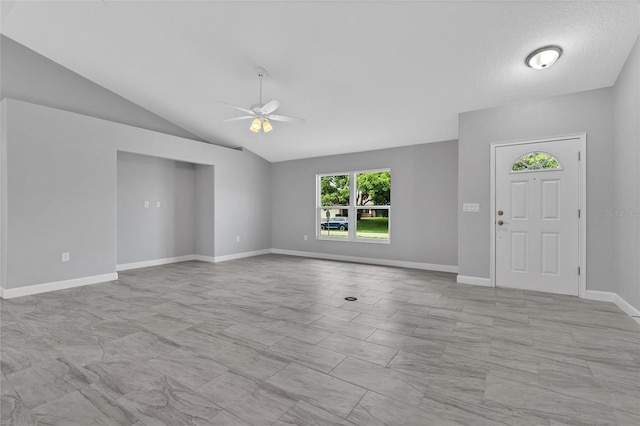 1329 N Old Mill Dr, Deltona, FL 32725 - unfurnished living room with baseboards, lofted ceiling, and a ceiling fan