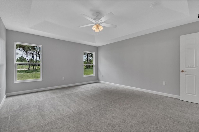 1329 N Old Mill Dr, Deltona, FL 32725 - carpeted empty room featuring a ceiling fan, a raised ceiling, and baseboards