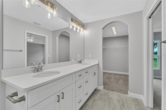 1329 N Old Mill Dr, Deltona, FL 32725 - full bath featuring double vanity, visible vents, a spacious closet, and a sink