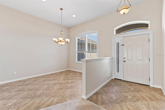 entryway featuring recessed lighting, baseboards, and a chandelier