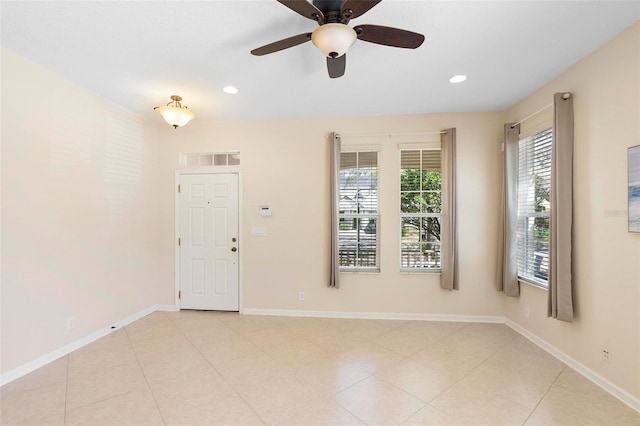 unfurnished room featuring light tile patterned flooring, recessed lighting, and baseboards