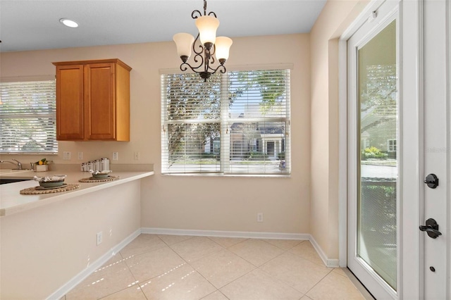 unfurnished dining area with light tile patterned floors, baseboards, a chandelier, and recessed lighting