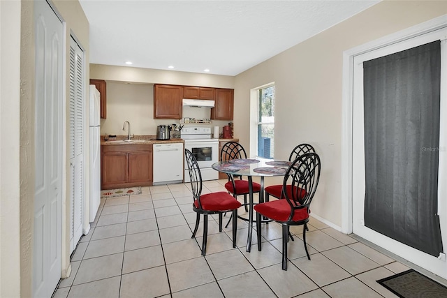 dining space with light tile patterned floors, recessed lighting, and baseboards