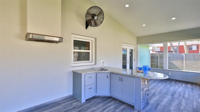 interior space with a sink, french doors, and exterior kitchen