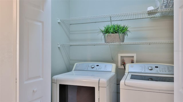 laundry room with laundry area and washer and clothes dryer