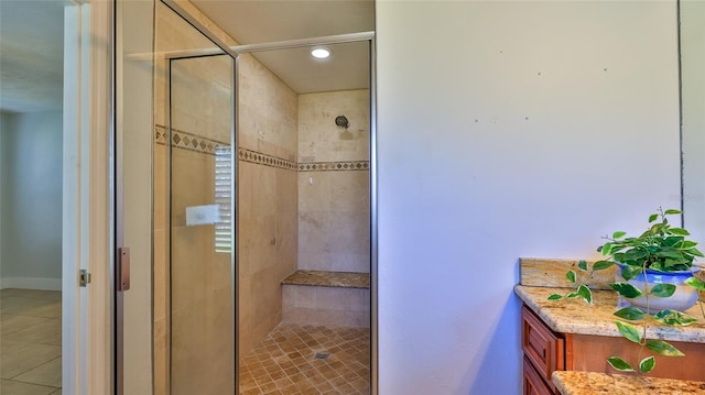 full bathroom featuring tile patterned floors and a stall shower