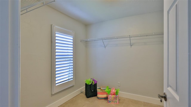 spacious closet featuring tile patterned flooring