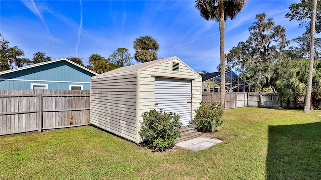 view of shed featuring a fenced backyard