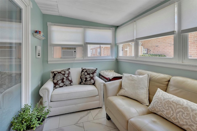 living area featuring vaulted ceiling, cooling unit, and marble finish floor