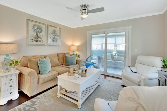 living room featuring dark wood-type flooring, ornamental molding, and ceiling fan