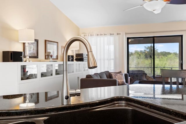 kitchen featuring a ceiling fan and vaulted ceiling