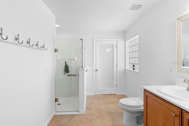 full bathroom featuring tile patterned flooring, visible vents, toilet, a stall shower, and vanity