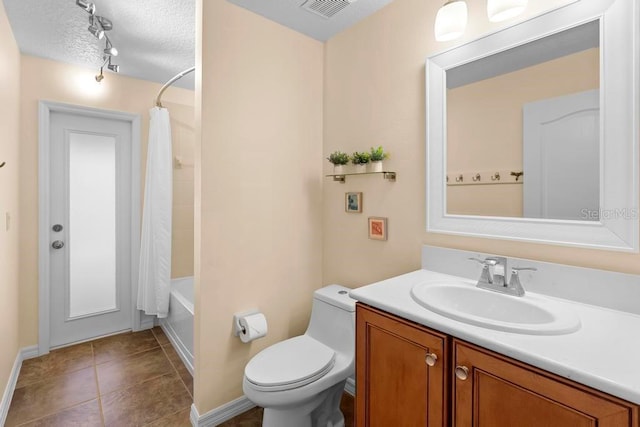 full bathroom with vanity, visible vents, a textured ceiling, tile patterned floors, and toilet