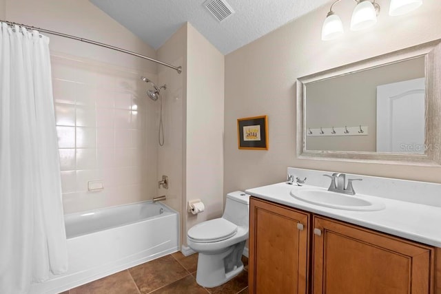 bathroom with vanity, visible vents, shower / bath combo with shower curtain, tile patterned floors, and toilet