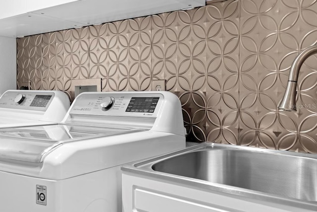 laundry room featuring washing machine and dryer and laundry area