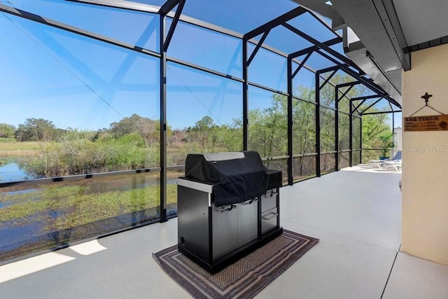 view of patio / terrace featuring a lanai and grilling area