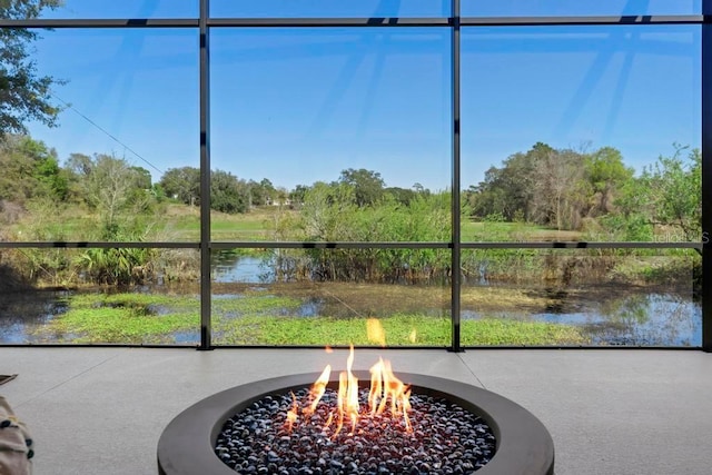 sunroom with a water view