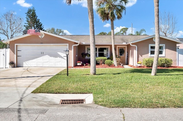 ranch-style house featuring fence, driveway, an attached garage, stucco siding, and a front lawn