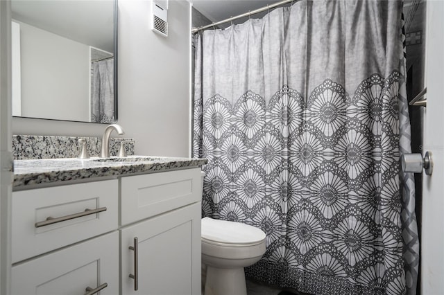 full bathroom featuring visible vents, toilet, and vanity