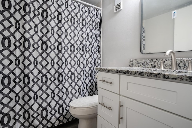 bathroom featuring vanity, curtained shower, toilet, and visible vents