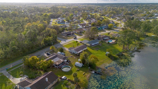 bird's eye view with a residential view and a water view