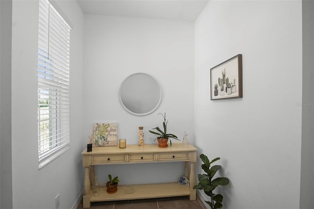 hallway with tile patterned flooring