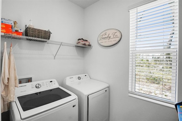 laundry room with laundry area and washing machine and clothes dryer