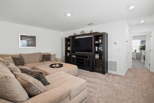 carpeted living room featuring recessed lighting, visible vents, and baseboards