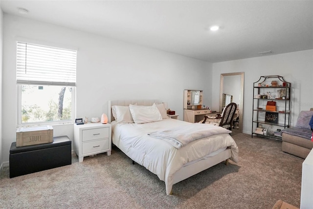 bedroom with visible vents and carpet floors