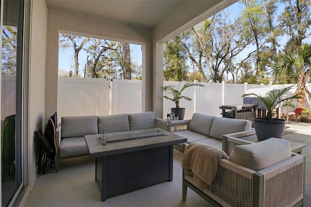 view of patio / terrace with an outdoor living space and a fenced backyard