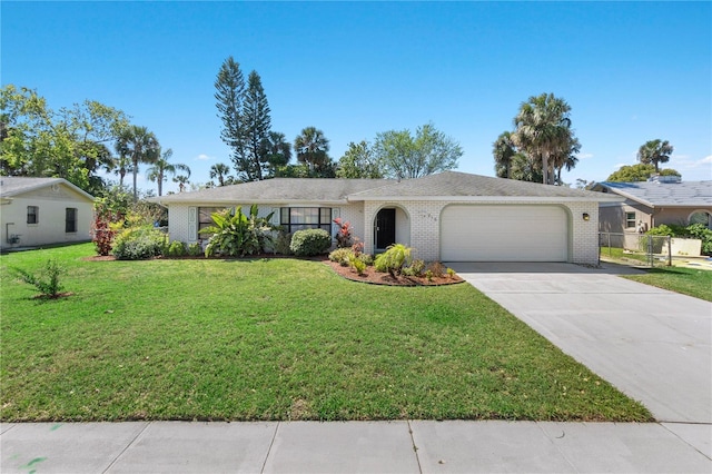 ranch-style home featuring fence, driveway, a front lawn, a garage, and brick siding