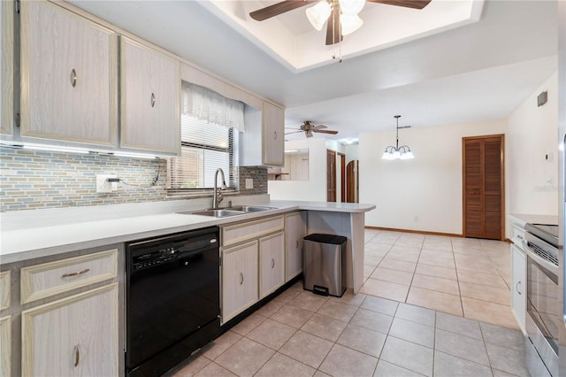 kitchen featuring stainless steel range with electric stovetop, a sink, a tray ceiling, a peninsula, and dishwasher