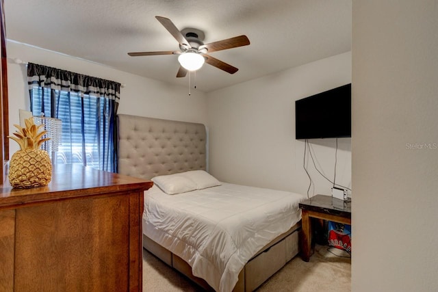 bedroom featuring carpet flooring and a ceiling fan