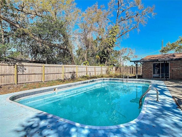 view of pool featuring a fenced in pool and a fenced backyard