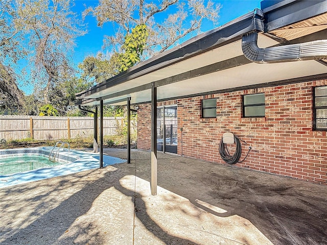 view of patio / terrace featuring fence