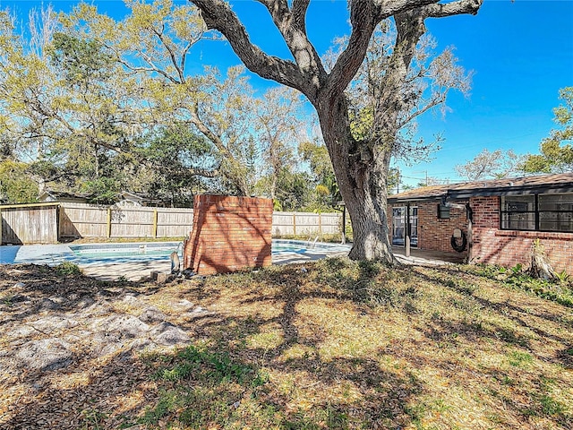 view of yard with a patio area and a fenced backyard