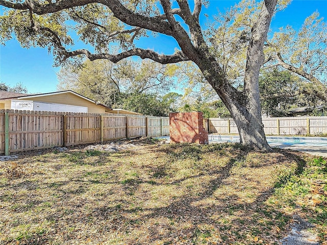 view of yard with a fenced backyard