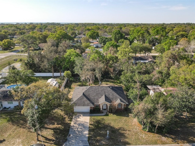 drone / aerial view featuring a forest view