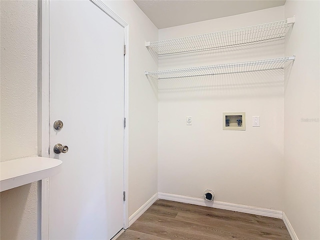 laundry room featuring baseboards, washer hookup, laundry area, wood finished floors, and electric dryer hookup